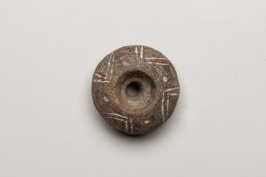 Verzierter Spinnwirtel