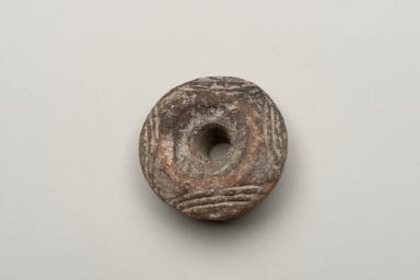 Verzierter Spinnwirtel